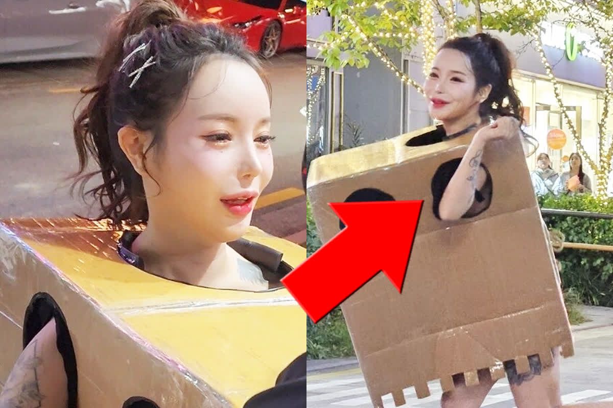 naked-woman-in-a-box-roams-street-asking-to-touch-inside-performance